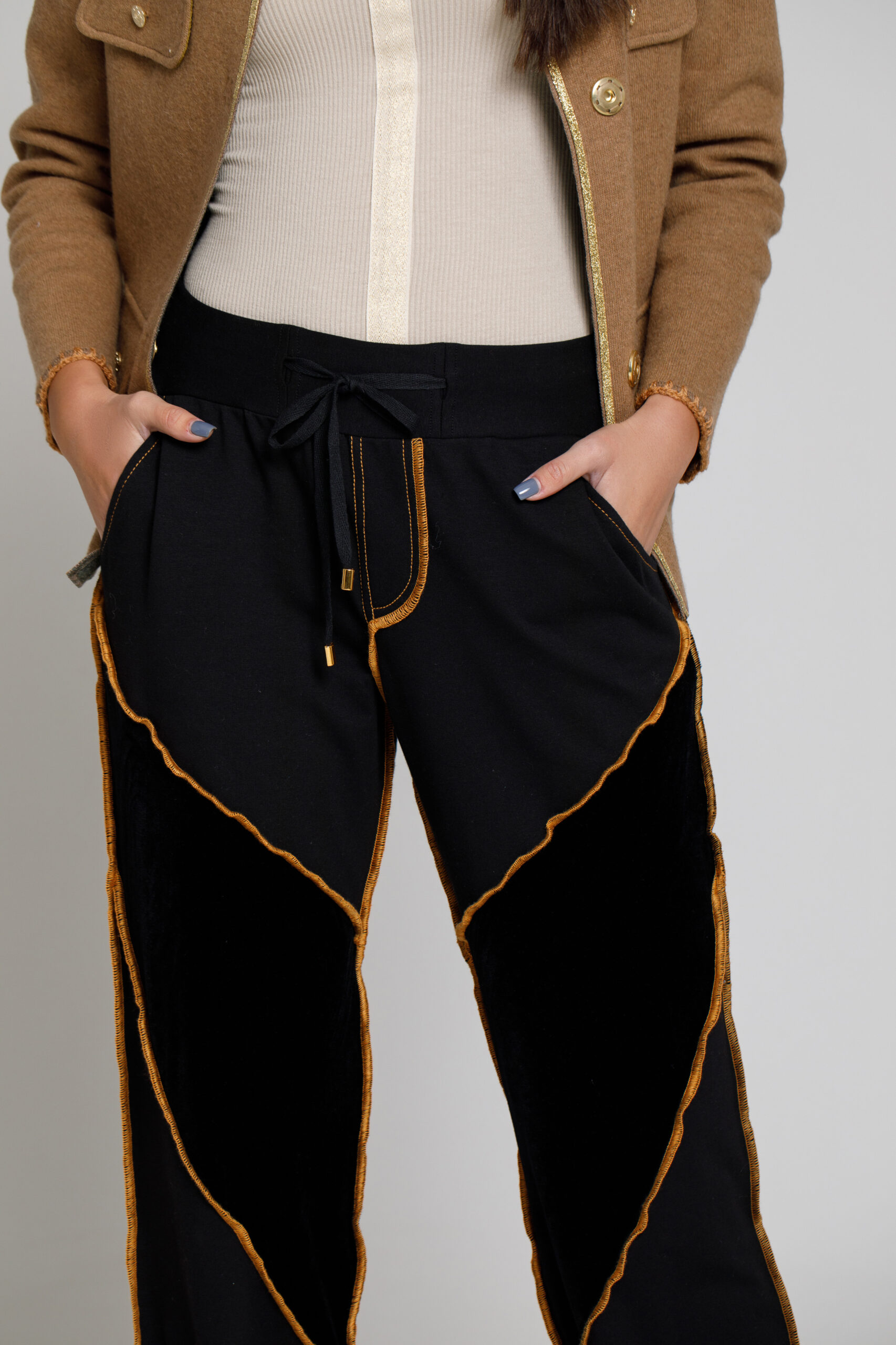 MORY pants made of black felt and velvet with highlighted seams. Natural fabrics, original design, handmade embroidery